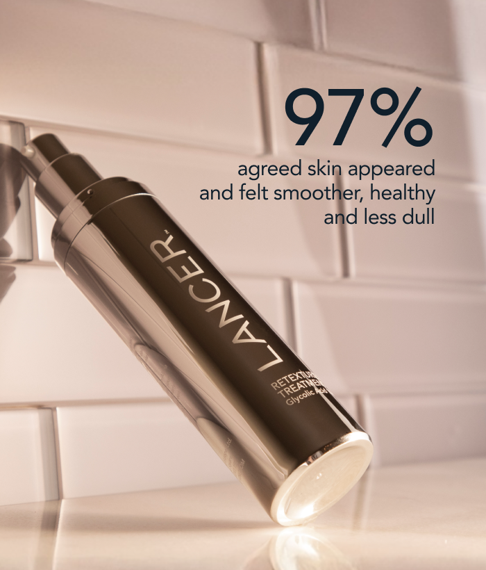 Lancer skincare serum bottle on a white tiled background with text about skin improvement.-Lancer Skincare