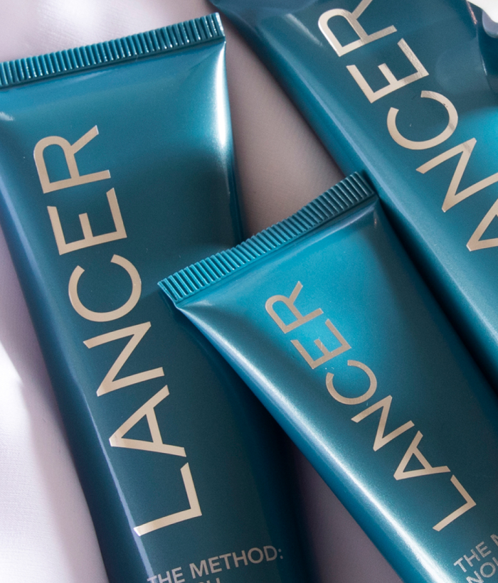 Three blue Lancer skincare products on a light background-Lancer Skincare