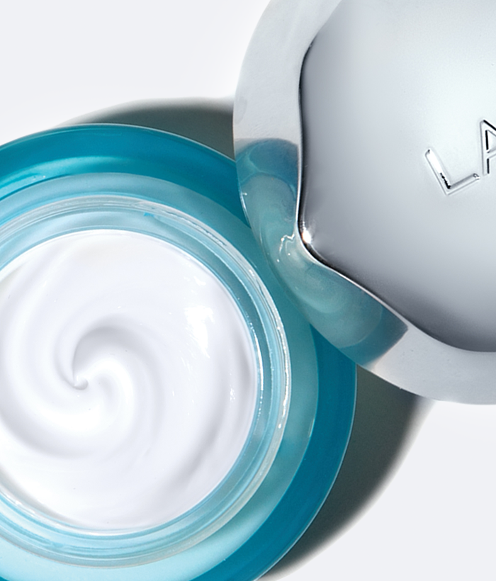 Open jar of cream with visible brand logo on a white background-Lancer Skincare
