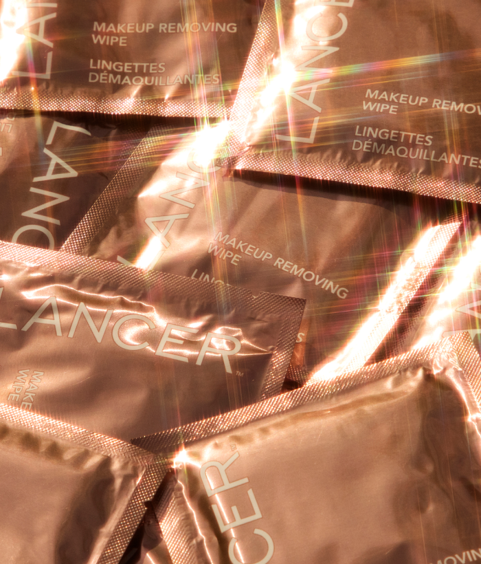Close-up of Lancer makeup removing wipes with a shiny, reflective surface.-Lancer Skincare