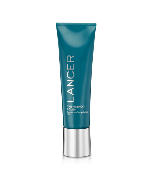 Blue skincare tube with silver cap on a white background