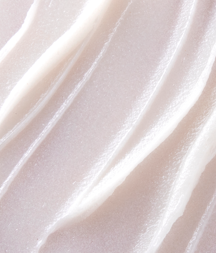 Close-up of smooth, light white face exfoliator