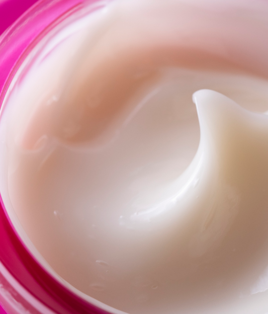 Lancer skincare product with pink jar and silver lid on a white background