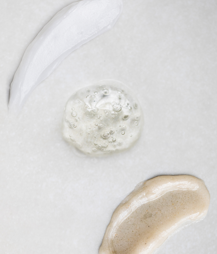 Three swatches of skincare products on a light gray background-Lancer Skincare