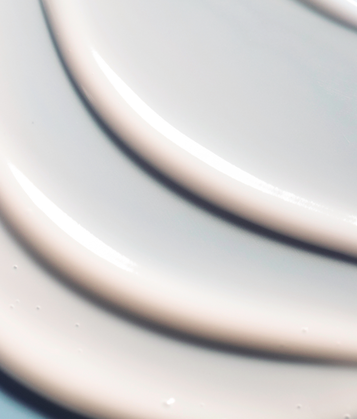 Close-up of a cream colored face serum