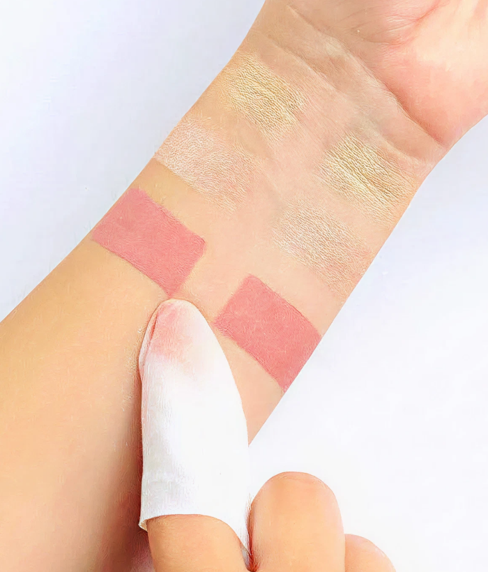 Makeup swatches on a person's arm being wiped off by Makeup Removing Wipe-Lancer Skincare